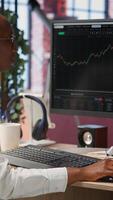 Vertical Day trader reacting with frustration after losing money in cryptocurrency investment due to rug pull. Woman suffering emotional toll of financial loss after trading plummeting crypto coin, camera B video