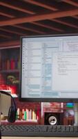 Vertical Programming code on PC display used for developing software programs. Binary script on computer at home used for fixing errors in applications and implementing new features, jib up shot video