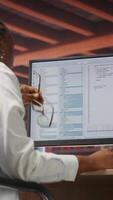 Vertical Irked software developer frustrated while coding, struggling to implement algorithms. Unhappy IT expert annoyed while working with code editor, unable to optimize performance, camera B video