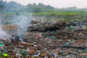 Pile of garbage in the countryside. Pollution of environment concept. photo