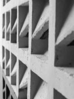 a black and white photo of a wall with squares