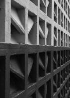 a black and white photo of a wall with geometric shapes