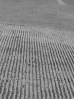 black and white photo of a street with a crosswalk