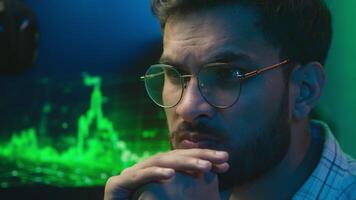 Thoughtful Arabian Indian man businessman working computer crypto currency trading thinking analyst planning ideas inspiration male programmer freelancer coder solve business home bitcoin guy create video