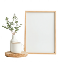 A minimalistic setting featuring a plant, mug, and empty frame for creative inspiration. png