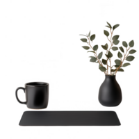 Minimalist workspace featuring a black mug and a sleek vase with foliage. png