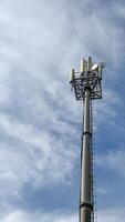 Mobile data tower with antennas against a blue sky. The concept of telecommunication equipment, high-speed mobile communication. High quality photos
