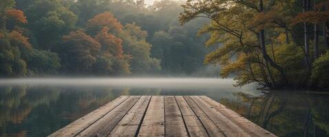 Scenic wooden dock on a tranquil lake surrounded by lush greenery and vibrant trees in a serene woodland setting. photo