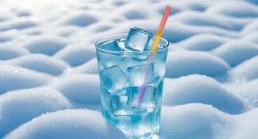 Refreshing Cold Beverage with Ice and Straw on a Bright Background. photo