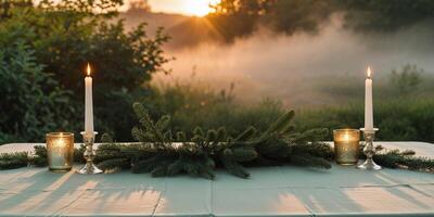 Serene outdoor candlelit table setting at sunset with greenery in nature background photo