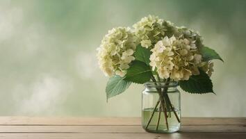 Bouquet of hydrangeas flowers in a glass jar on a wooden table with blurred green background photo