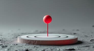 Red pin in the center of circular target on textured surface. photo