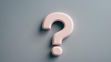 Pastel pink question mark with rounded edges on a soft gray background conveying curiosity and inquiry photo