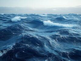 A vast, turbulent ocean scene with waves and a cloudy sky. photo