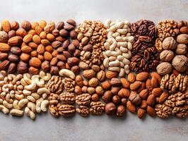 A vibrant assortment of various nuts and seeds arranged in a visually appealing pattern. photo