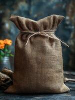 A burlap sack tied with twine, suggesting storage or transport of goods. photo