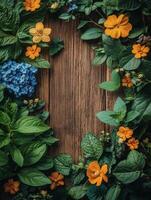 A floral arrangement with vibrant flowers and greenery surrounding a wooden surface. photo