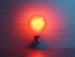 A glowing light bulb with a neon filament against a textured wall. photo
