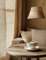 A cozy corner featuring a cup of coffee on a wooden table beside a soft sofa and curtains. photo