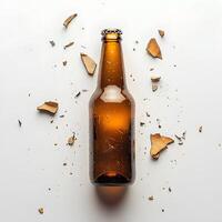 Brown Beer Bottle Surrounded By Shattered Glass Pieces photo