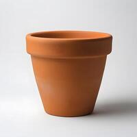 A terracotta flower pot sits on a white background photo