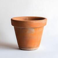 A Terracotta Pot Stands On A White Background photo