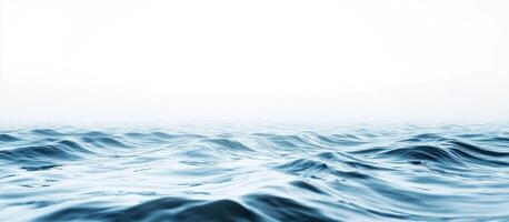 Calm Blue Ocean Waves with a White Sky photo