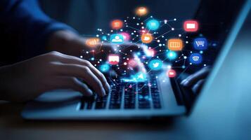 Person Typing on Laptop with Social Media Icons Hovering Above photo