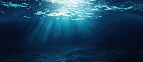 Underwater View of Sunlight Rays and Ocean Floor photo