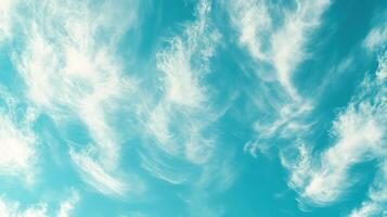 White Wispy Clouds Against a Vibrant Blue Sky photo