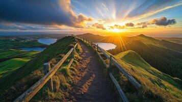 Sun-kissed Path Leading Through Mountainous Landscape at Sunset photo