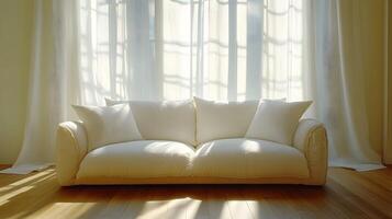Modern interior displays elegant white sofa with flowing sheer curtains, natural sunlight streaming through windows, creating airy atmosphere in minimalist living space. peaceful photo