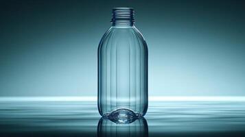 A clear bottle stands elegantly, reflecting ambient light on water's surface photo