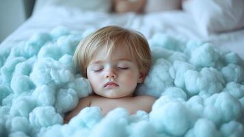 A toddler enjoys a blissful slumber surrounded by a soft, fluffy blanket photo
