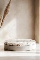 Modern Nordic-style podium featuring smooth concrete base with terrazzo slab against soft beige background for versatile text overlay photo