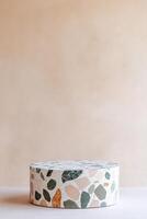 Modern terrazzo podium featuring pastel stone chips against a soft neutral backdrop ideal for presentations and displays photo