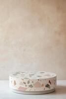 Sleek terrazzo podium featuring natural stone chips in pastel colors against a soft neutral backdrop for modern displays in Nordic style photo