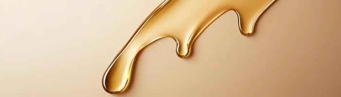 Luxurious golden oil drips gracefully on a matte beige surface, creating a serene and modern backdrop for cosmetic branding and beauty products photo