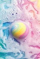 Vibrant bath bomb dissolves in water, creating swirling rainbow patterns against a pastel background photo