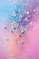 Scattered glittery eyeshadow pigments create a magical pastel wonderland on a soft rainbow gradient background with ample space for text overlay photo