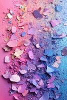 Colorful pastel glitter eyeshadow pigments scattered on a rainbow gradient background with clean space for text overlay photo
