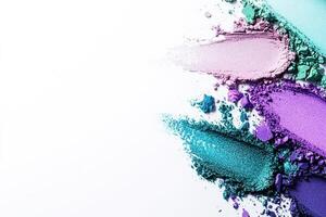 Vibrant eyeshadow smudges create a modern abstract background in shades of purple, blue, and green on a clean white surface designed for creative text overlays photo
