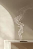 Gentle gray smoke rises gracefully across a smooth beige surface, creating an elegant backdrop that exudes calmness and sophistication, perfect for text overlay and design photo