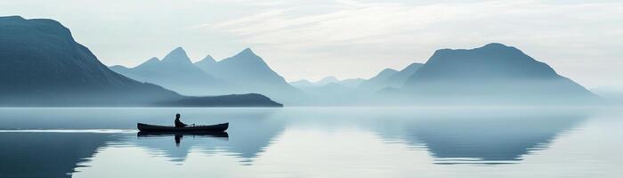 Kayaking on tranquil waters in a Nordic fjord creates a serene atmosphere, complemented by soft pastel skies and muted gray mountains. A perfect getaway for adventure seekers photo