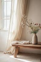 Delicate wildflowers fill a large vase on a minimalist wooden table, complemented by soft linen curtains billowing gently, creating a serene and natural ambiance in a bright space photo