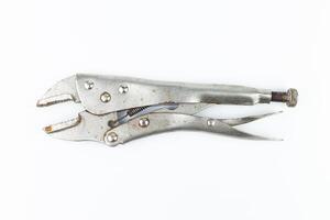 Old rusty pliers isolated on white background. Clipping path included. photo