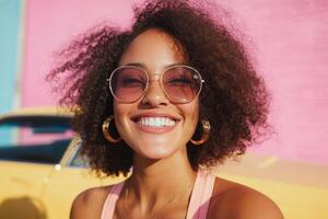 A woman with curly hair and sunglasses smiling photo