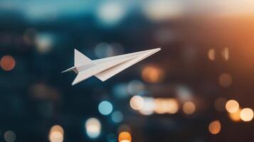 A white paper airplane flying photo