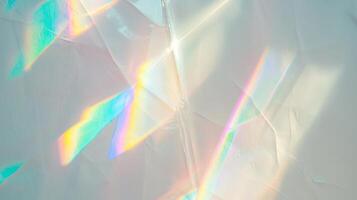 crystal prism rainbow light refraction texture on white wall photo