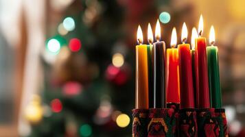 Kwanzaa kinara with seven lit candles in vibrant red photo
